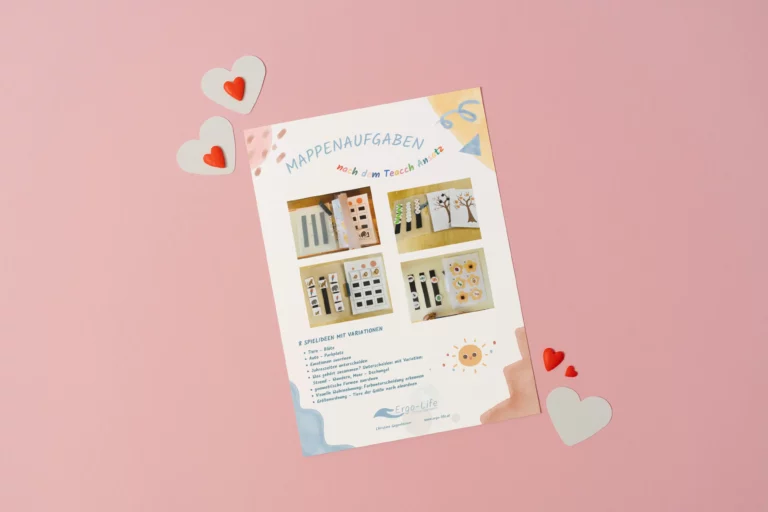 Blatt mit TEACCH-Mappenaufgaben auf rosa Hintergrund mit Herzen