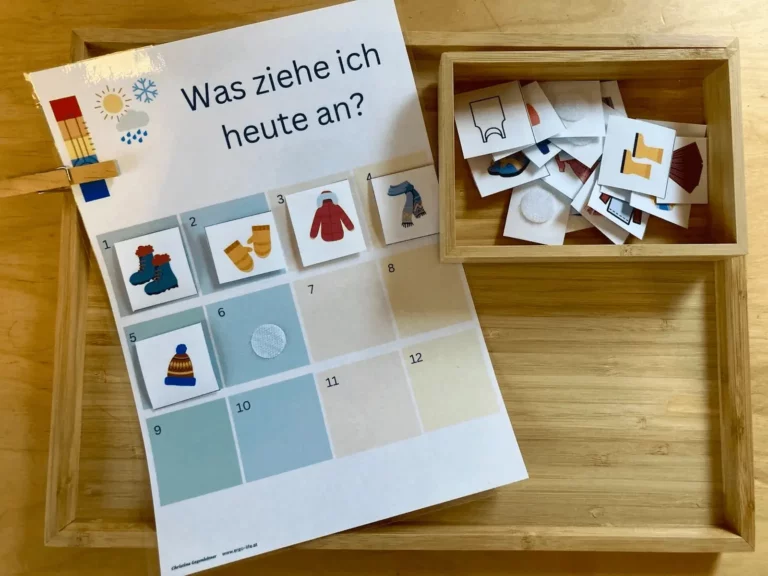Anziehplan „Was ziehe ich heute an?“ mit Bildkarten in einer Holzkiste